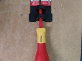 a yellow and red screwdriver laying on the floor
