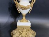 pair of antique white and gold vases on marble bases