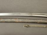 a picture of a sword and a chain on a table