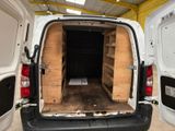 a white van with a wooden crate in the back of it