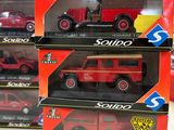 boxes of assorted toy vehicles are stacked on top of each other