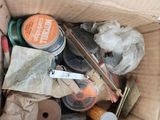 a cardboard box full of assorted items in it