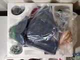 a plastic container filled with assorted items on a table