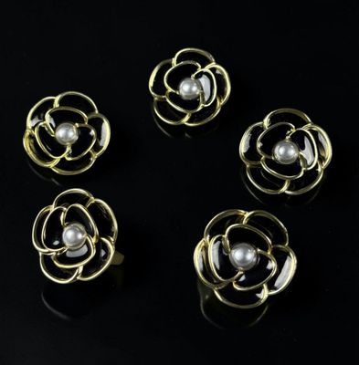 a set of five gold and pearl flower brooches