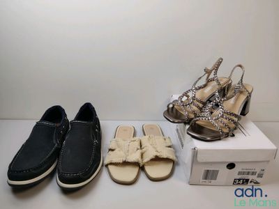 three pairs of women ' s shoes and a box of shoes