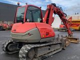 an image of a construction vehicle parked in a parking lot
