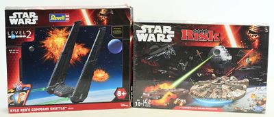two boxes of star wars electronic toys on the table