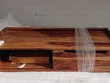 a wooden box with a ribbon on top of it