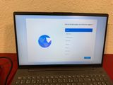 a laptop that is sitting on a table with a mouse