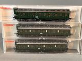 three train cars that are stacked on top of each other