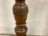 a wooden vase that is sitting on top of a table