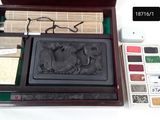 a wooden box with a stamper and a palette in it
