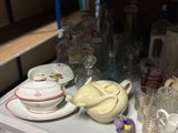 a table with a teapot, cups, and a teapot on it
