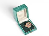 an image of a green box with a ring inside of it