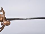 a person holding a sword in their hand on a white background