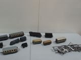 many different types of toy trains on the table