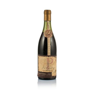 a bottle of wine sitting on top of a white surface