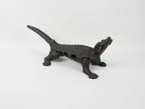 an old cast iron dog figurine on a white background