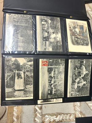 a lot of black and white pictures on a table