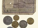 a lot of coins that are sitting on a piece of paper