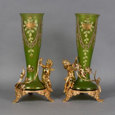 pair of green and gold vases with figures on them