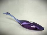 a purple spoon that is sitting on a table