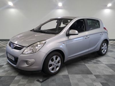 a picture of a silver car parked in a garage