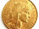 l'image d'une pièce d'or sur laquelle figure une tête de femme