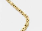 a gold necklace on a white background