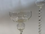 pair of clear glass candlesticks with a spiral base