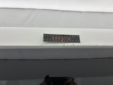 someone is taking a picture of a sign on the side of a boat
