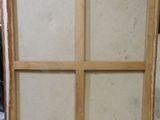 an old picture frame with a window in the middle of it