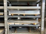 a large rack of metal shelves in a warehouse