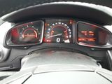 a close up of a car dashboard with various gauges