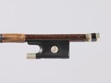 a close up of a violin bow on a white background