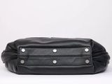 a black leather fanny bag with silver hardware detailing