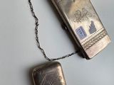 a silver case with a chain around it on a table