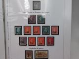 two books with different stamps on them sitting on a table