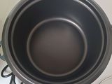 a pan that is sitting on a counter next to a glass