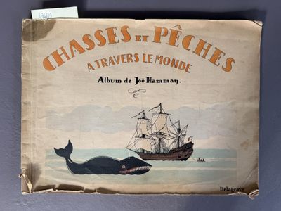 un vieux livre sur lequel figurent une baleine et un bateau