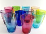 a lot of different colored glasses on a white surface