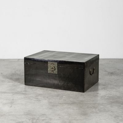 a black box sitting on a concrete floor