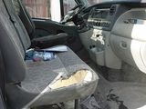 the interior of a truck with the seat up and the driver ' s seat down