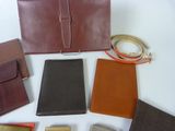 a lot of different types of purses and wallets on the table