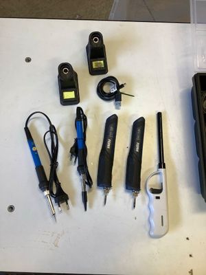 a lot of tools that are sitting on a table