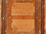 a close up of an old wooden frame with peeling paint on it
