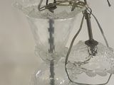 a glass vase with a spider on top of it