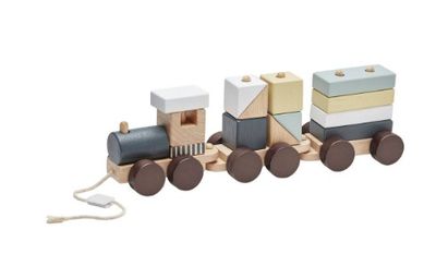 a wooden toy train that is sitting on a white surface
