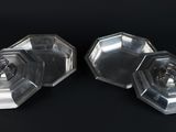 pair of clear glass knobs on a black background