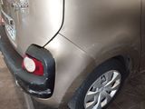 a silver car that is parked in a garage